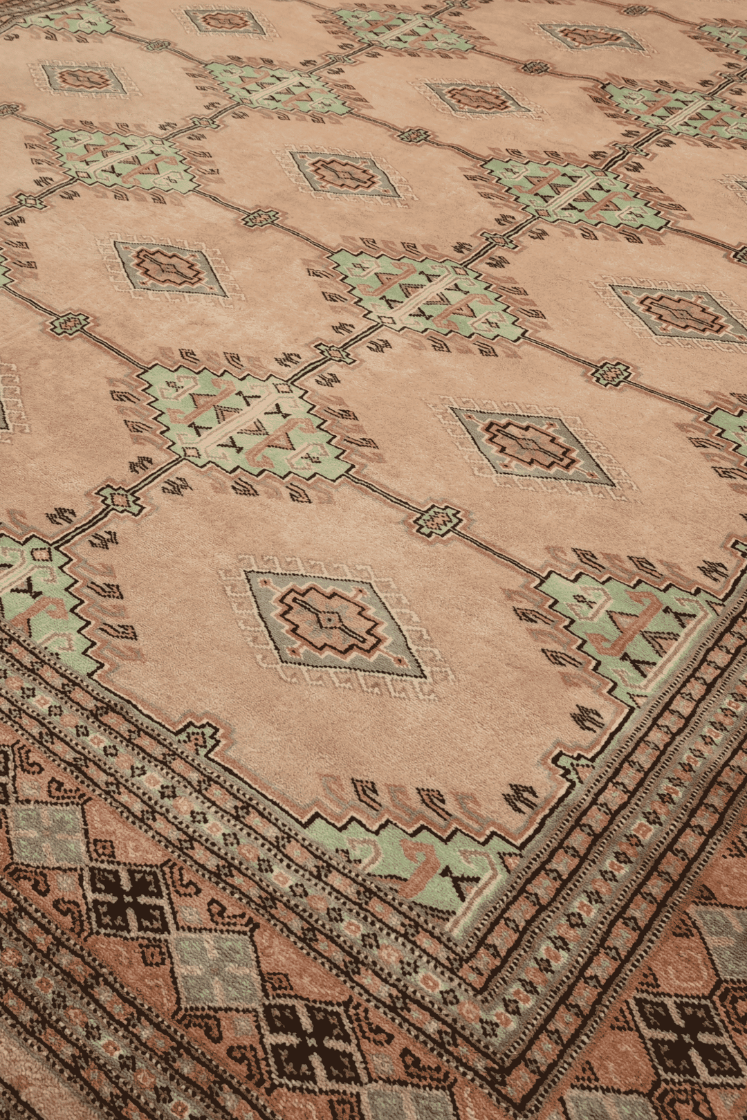 Alternating lattice detail in blush camel and sage on Pakistani rug