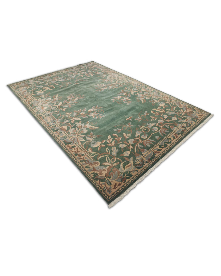 Hand-knotted green rug with Gol Farang floral on open field