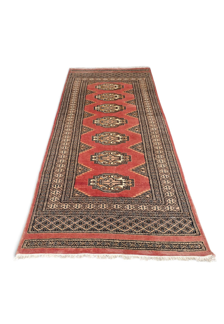 Border detail of terracotta and beige hand-knotted Yamoud rug