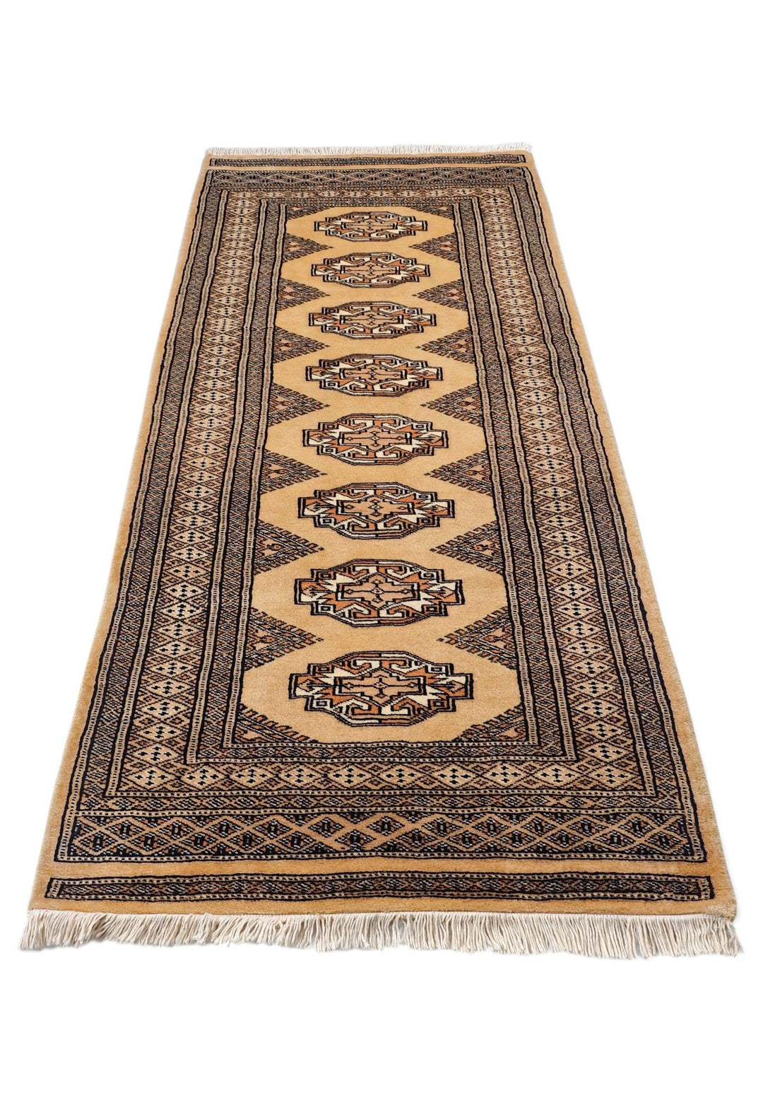 Border detail of wheat gold and beige hand-knotted Yamoud rug