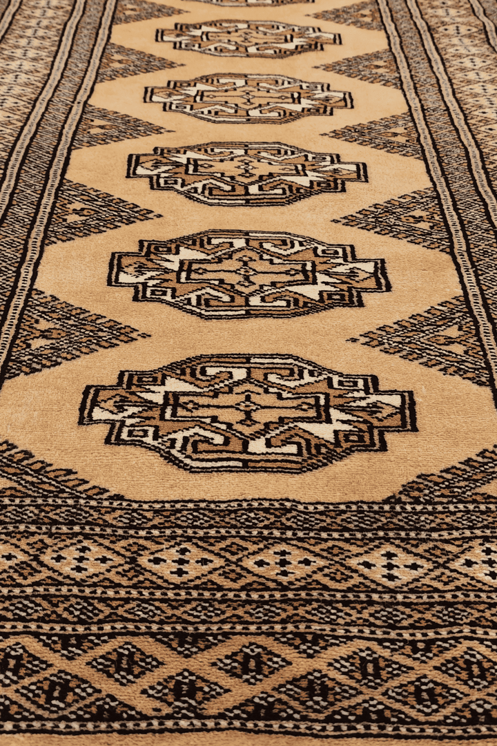 Hand-knotted wheat gold Yamoud rug with Turkmen design