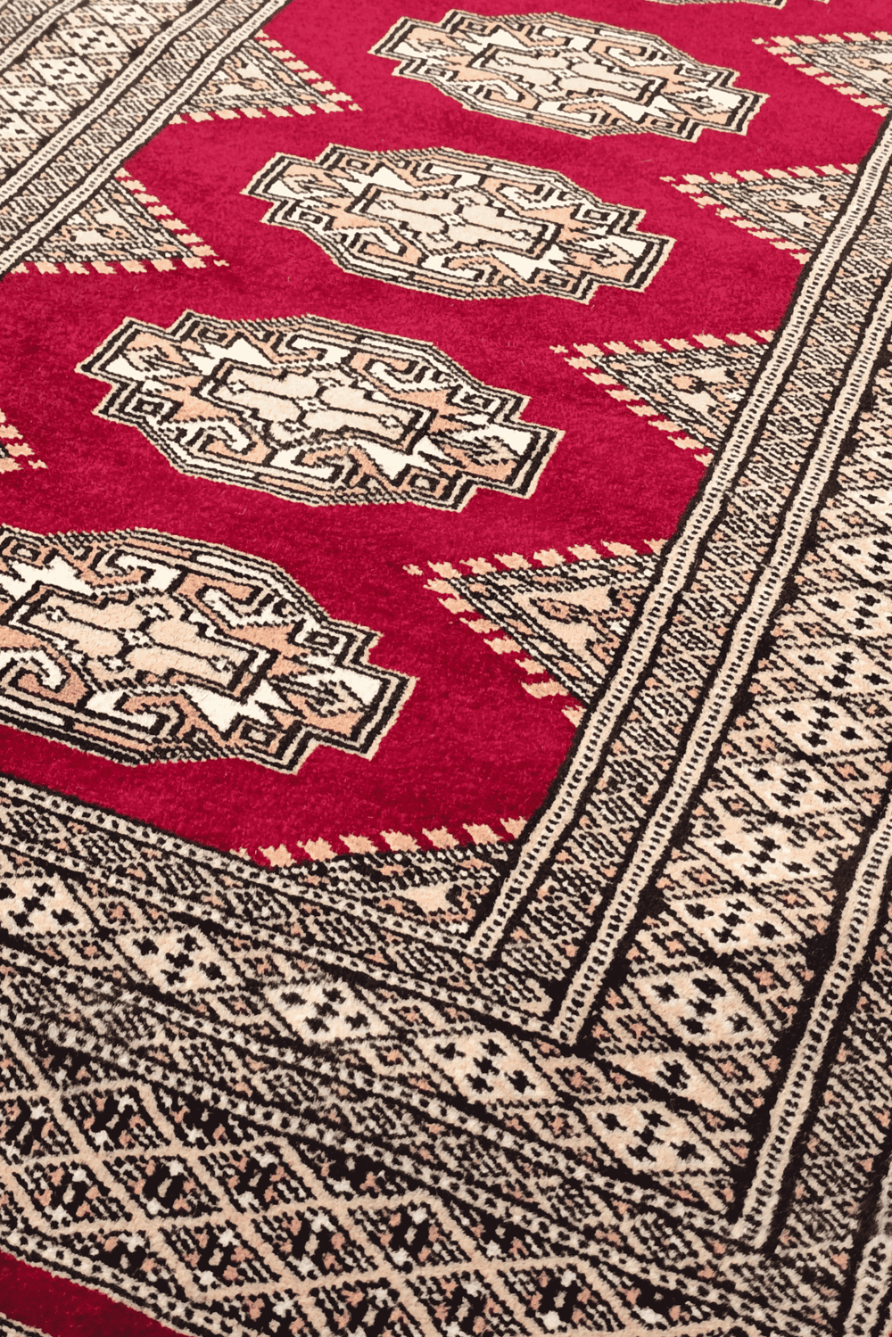 Turkmen Yamoud motifs in wine red and beige on wool rug