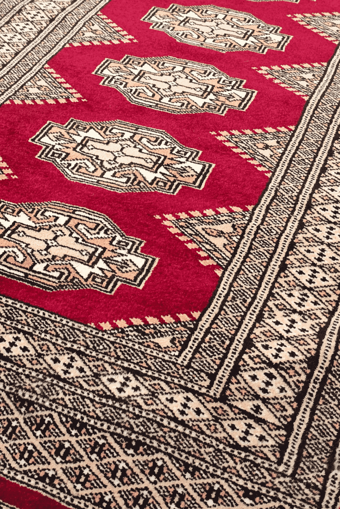 Turkmen Yamoud motifs in wine red and beige on wool rug