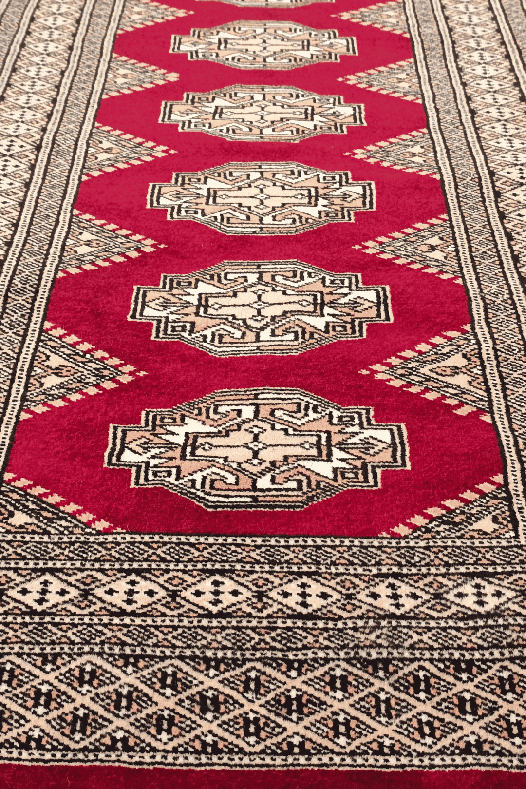Hand-knotted wine red Yamoud rug with Turkmen design