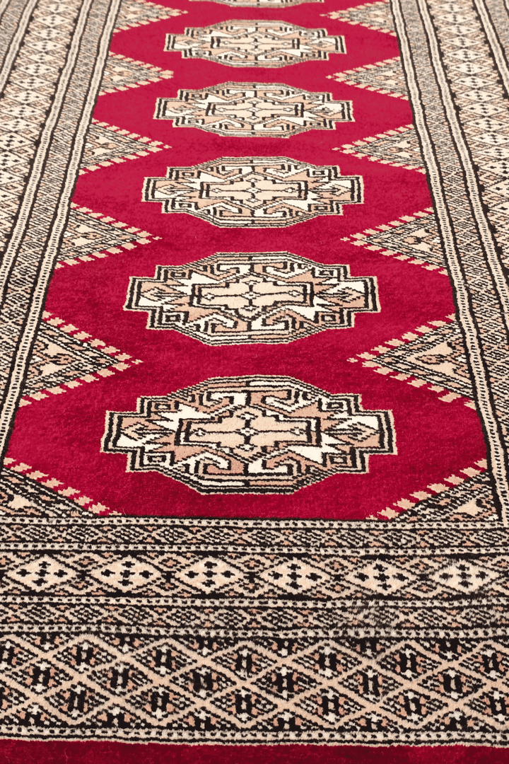 Hand-knotted wine red Yamoud rug with Turkmen design