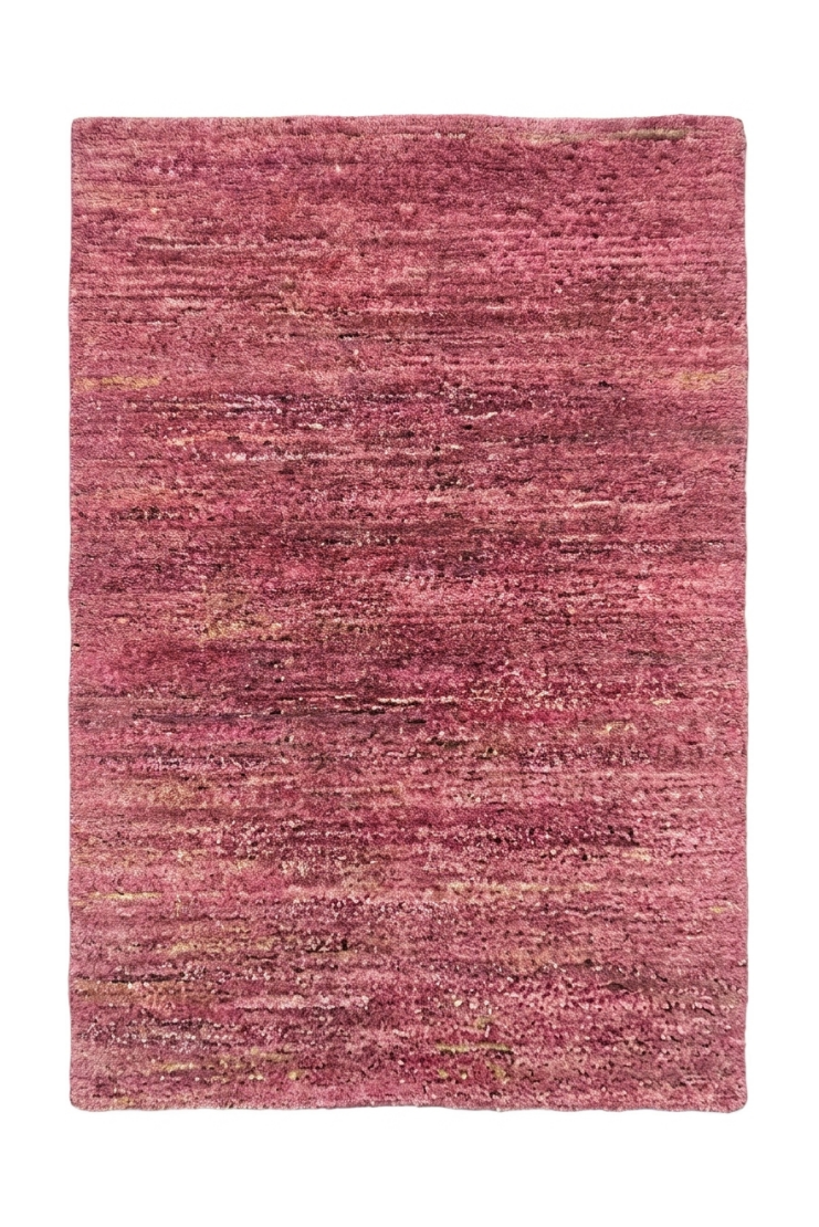 Pink textured rug on a white background