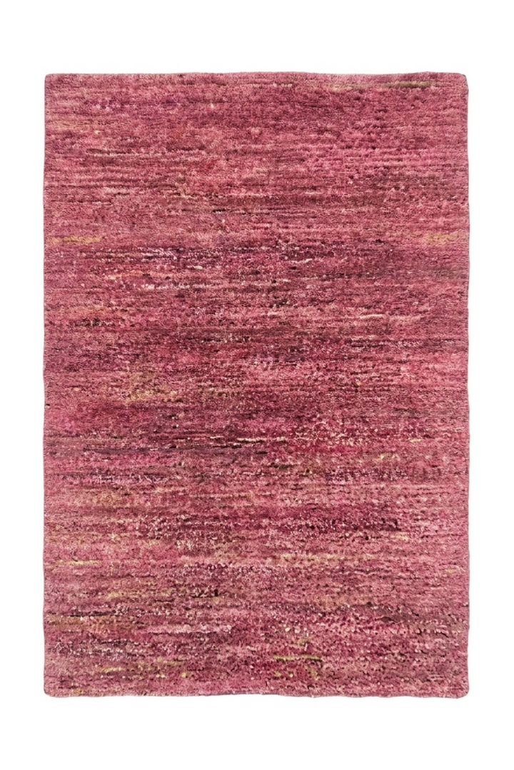 Pink textured rug on a white background