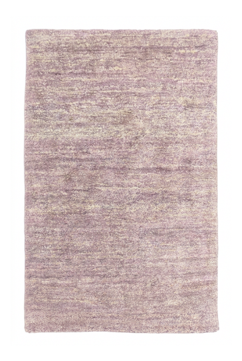 Textured purple rug on a white background