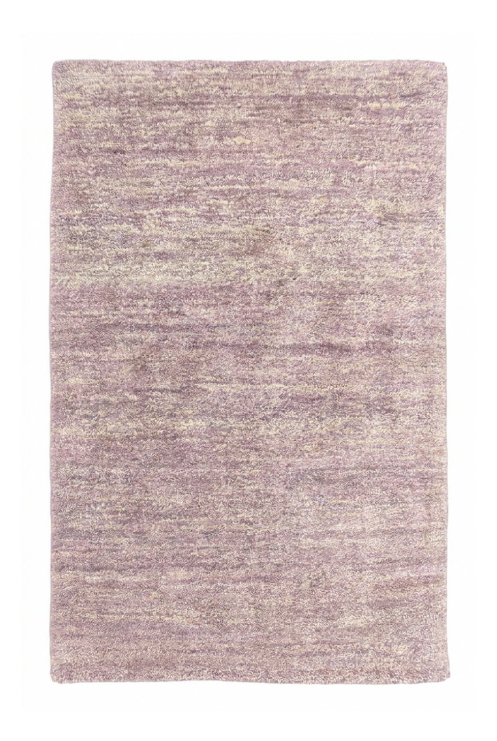 Textured purple rug on a white background