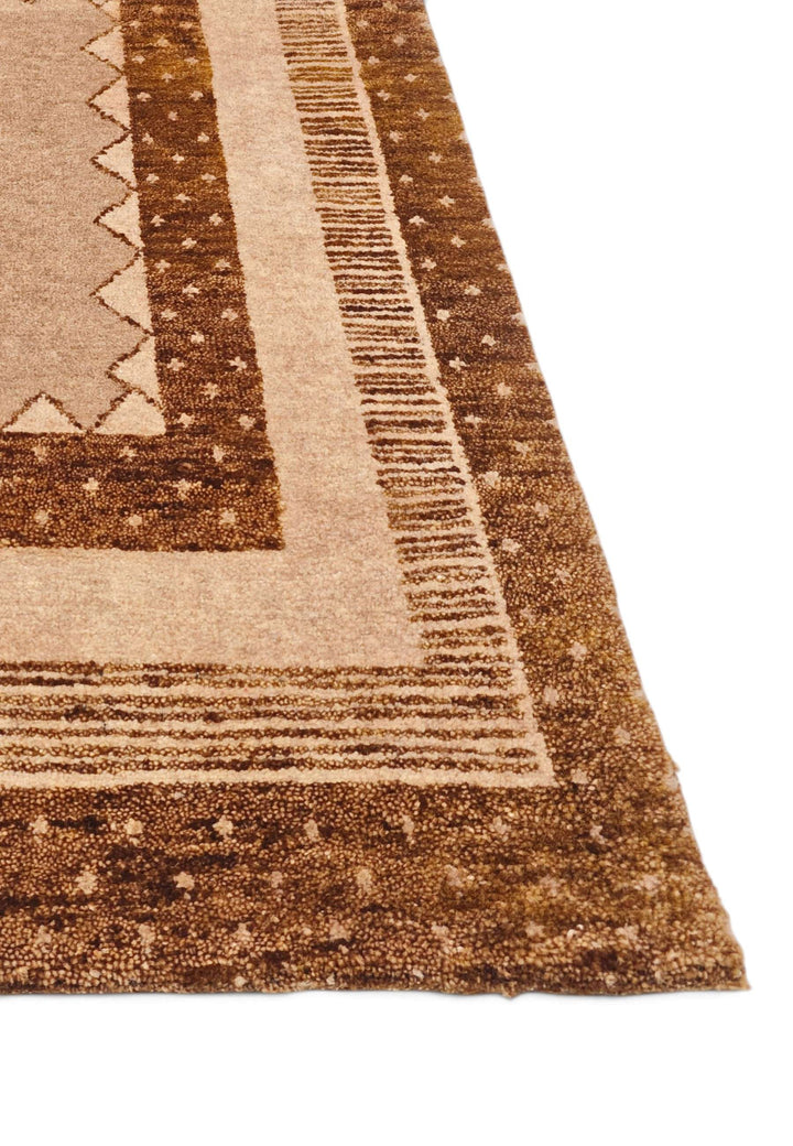 Corner of camel concentric frame Loribaf rug