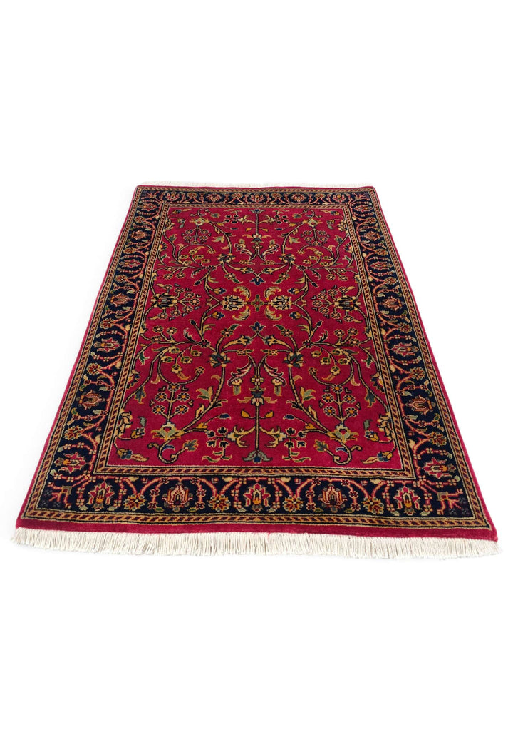 Border detail of crimson Sarouk hand-knotted Indian rug