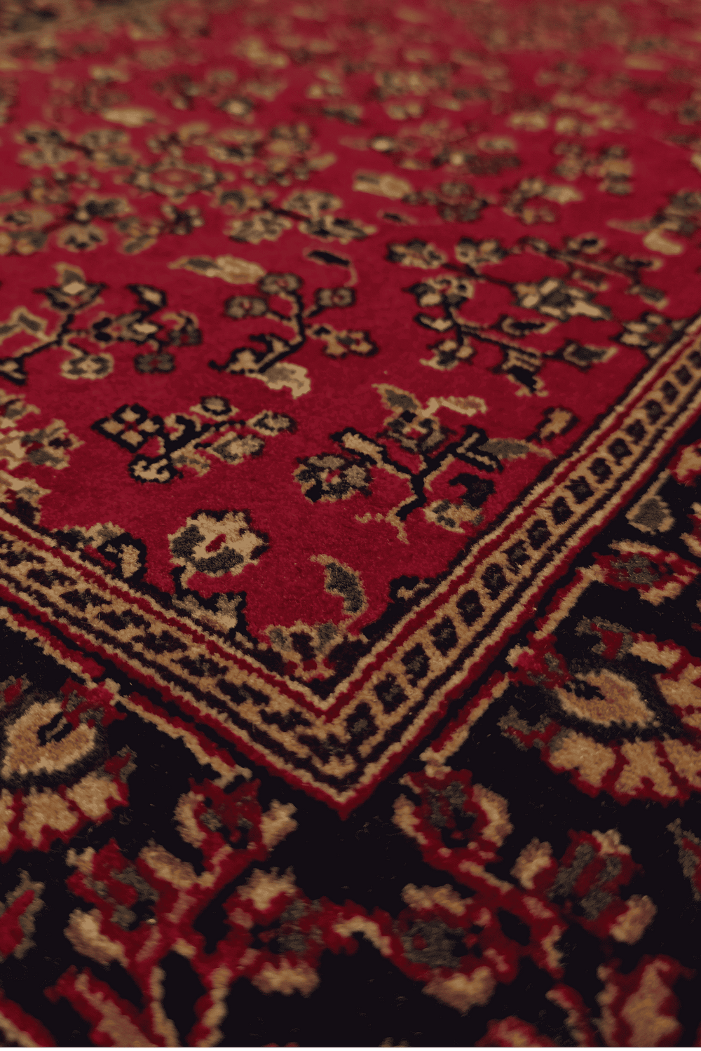 Sarouk garden floral detail in madder red and indigo