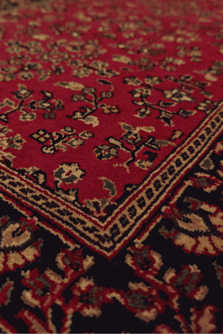 Sarouk garden floral detail in madder red and indigo