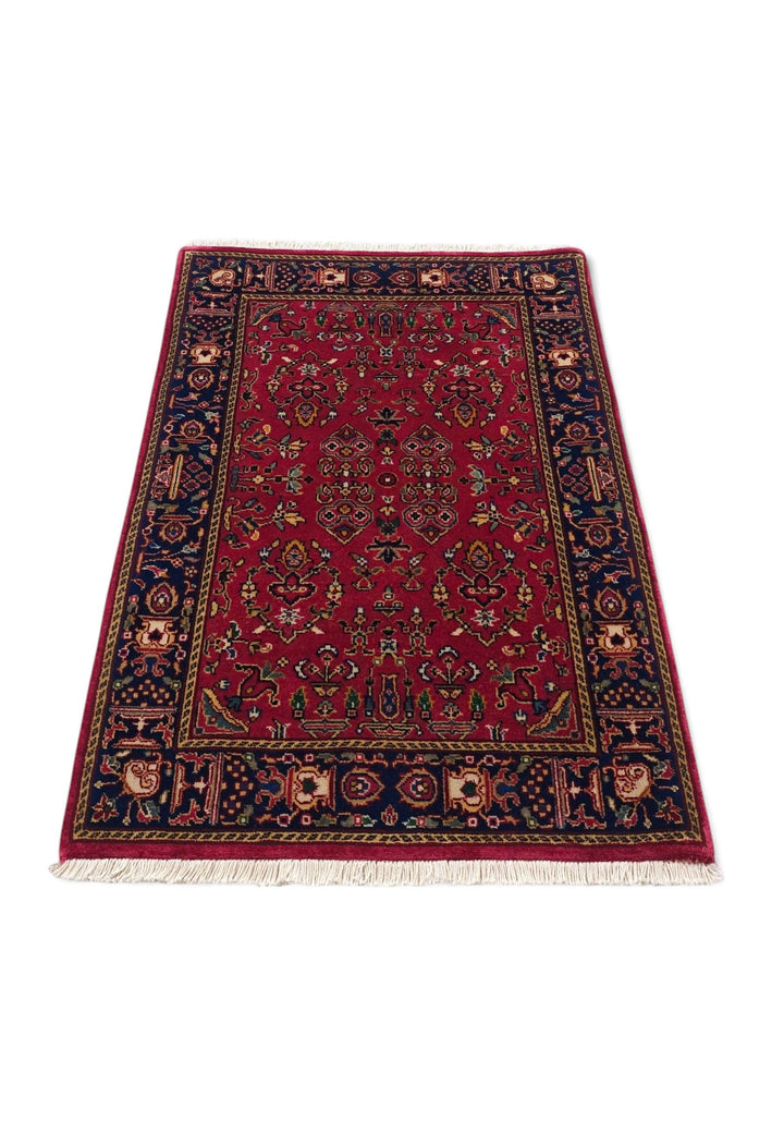 Border detail of madder red Sarouk Indian rug
