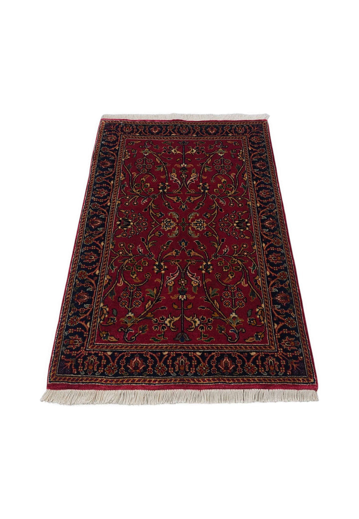 Border detail of oxblood Hereke hand-knotted Indian rug