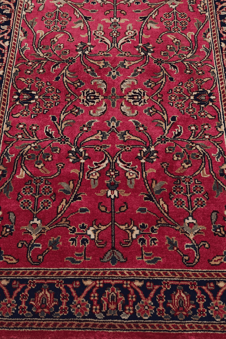One-of-a-kind magenta and navy Hereke Indian rug