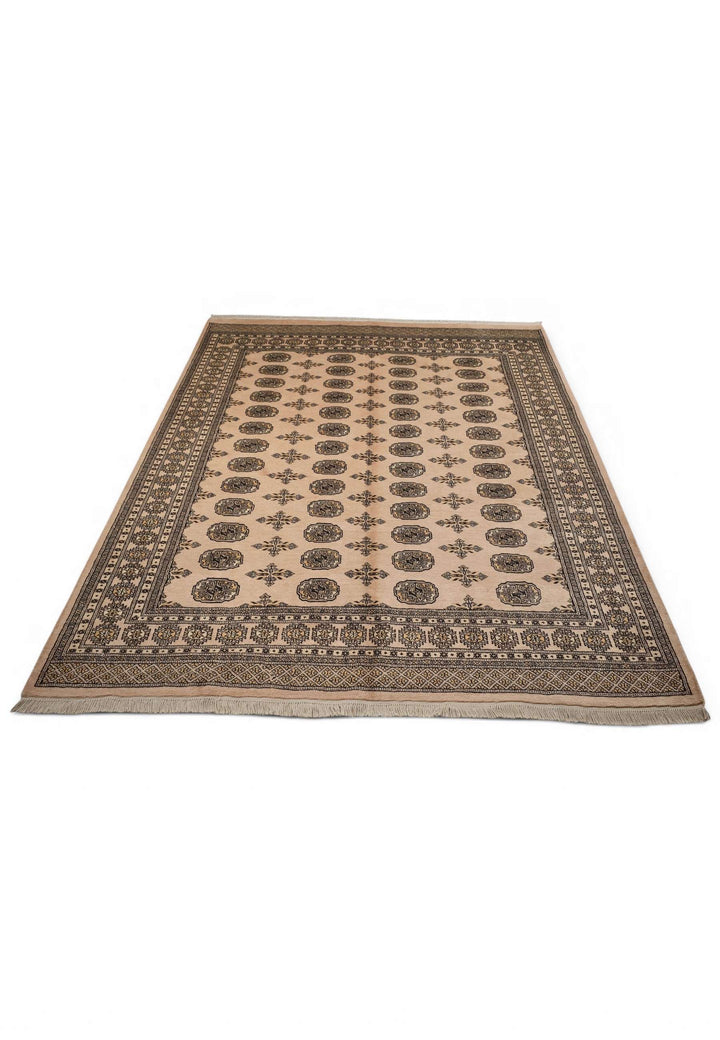 Border detail of camel beige and charcoal hand-knotted Bokhara rug