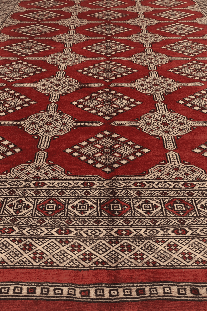 One-of-a-kind brick red and cream Pakistani Bokhara rug