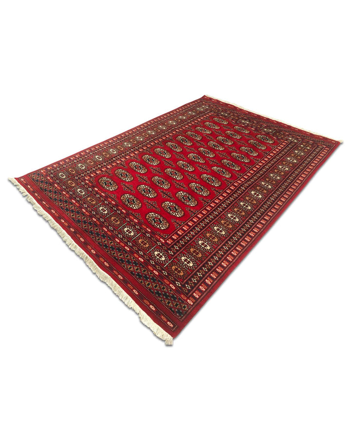 Bright red Turkmen gül rug for a bedside, about 1.5 tatami