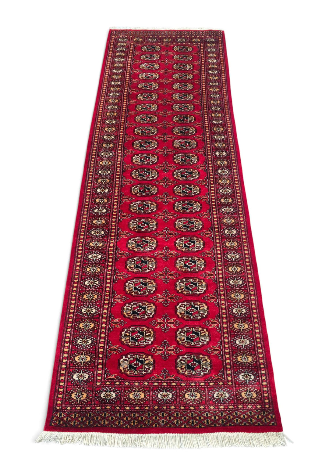 Border detail of bright red and gold hand-knotted Bokhara runner