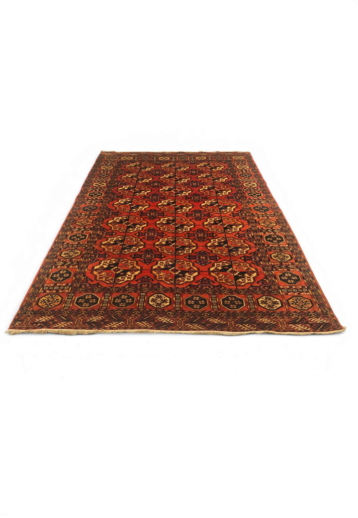 Border detail of burnt orange hand-knotted Afghan Sherwan rug
