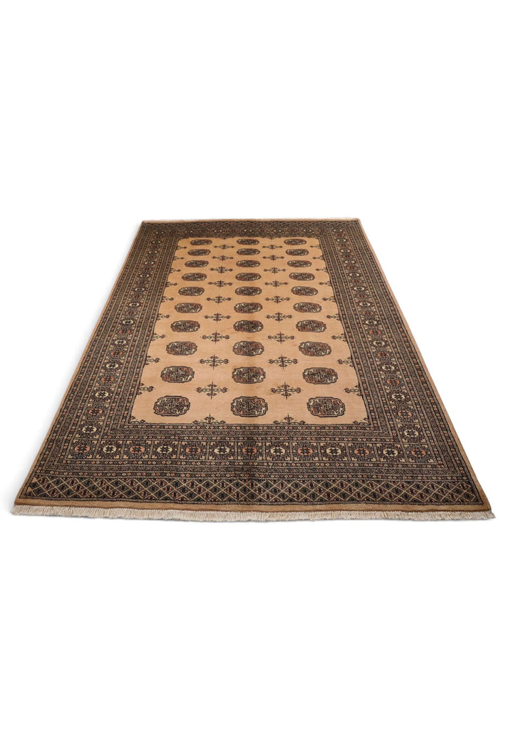 Border detail of camel and mahogany hand-knotted Bokhara rug