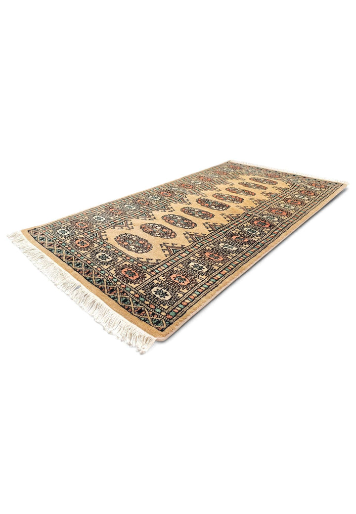 Gold peach Bokhara wool rug 69×134cm, Pakistani craftsmanship
