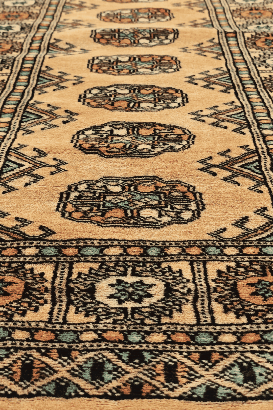 One-of-a-kind gold and peach Pakistani Bokhara entrance mat