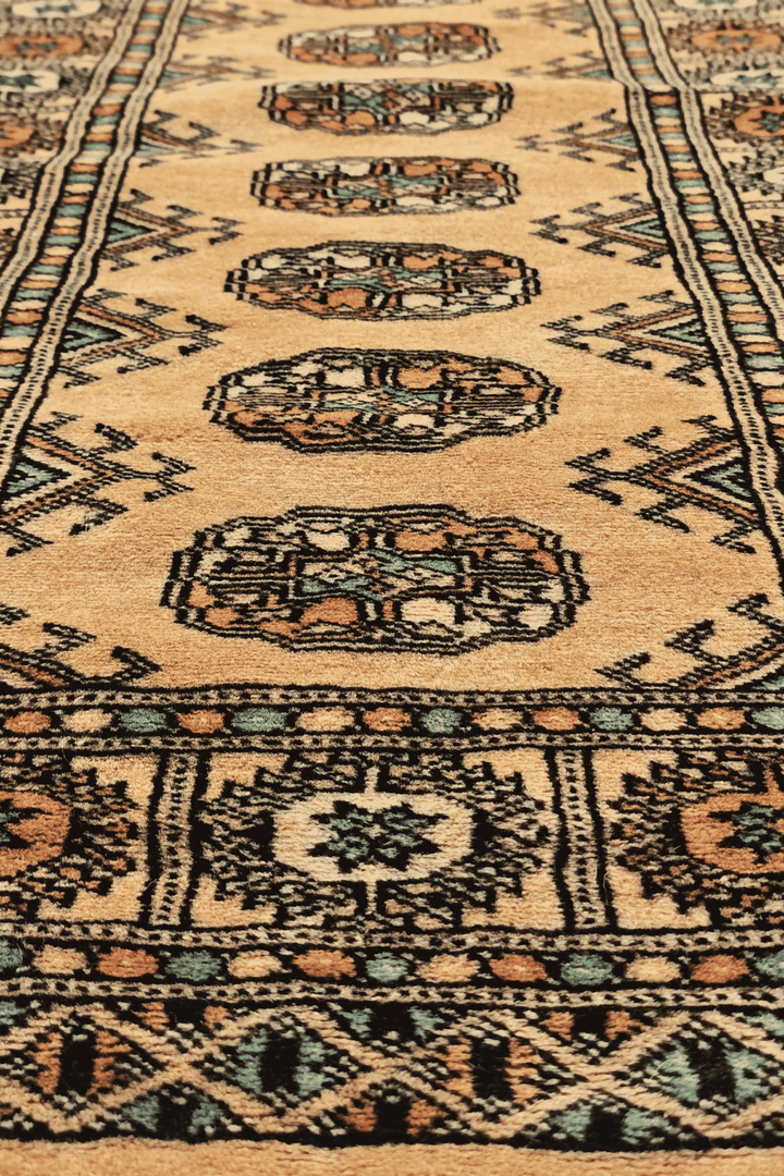 One-of-a-kind gold and peach Pakistani Bokhara entrance mat