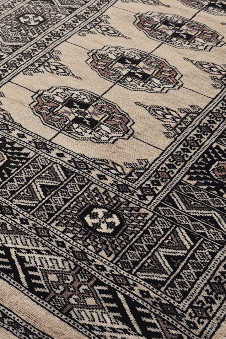 Turkmen gül motifs in camel and navy on long Bokhara runner