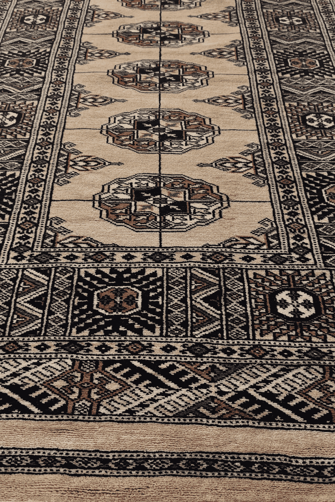 Hand-knotted camel Bokhara runner with navy Turkmen güls