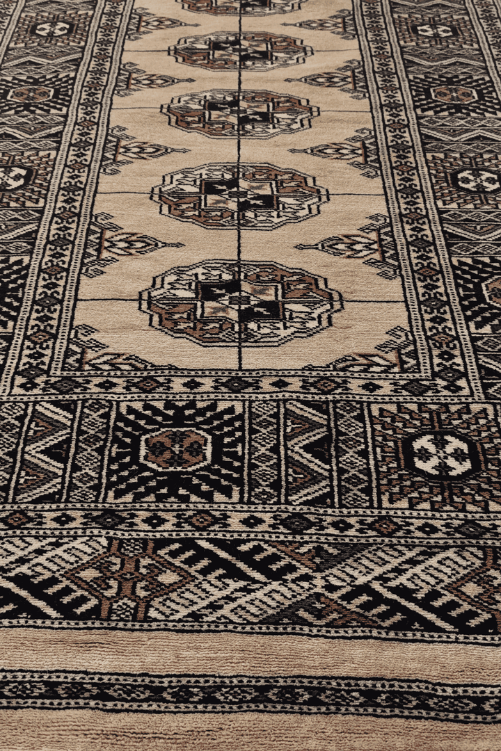 Hand-knotted camel Bokhara runner with navy Turkmen güls