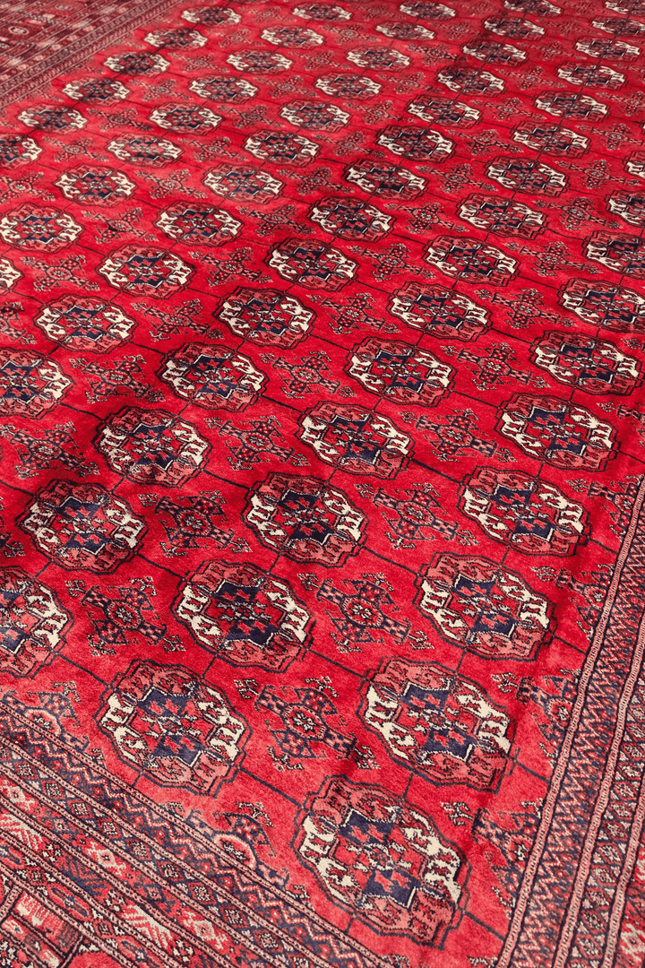 Turkmen gül motifs on cherry red Afghan Sherwan wool rug