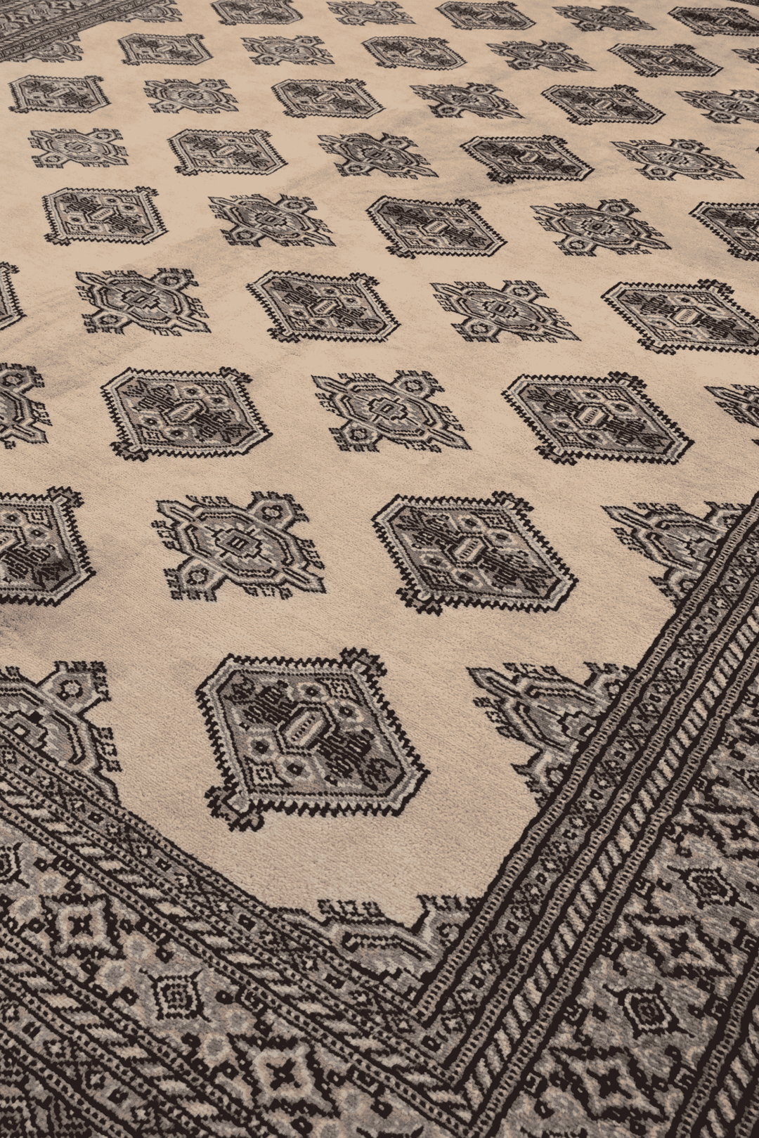 Turkmen gül motifs in cream and espresso on Bokhara rug
