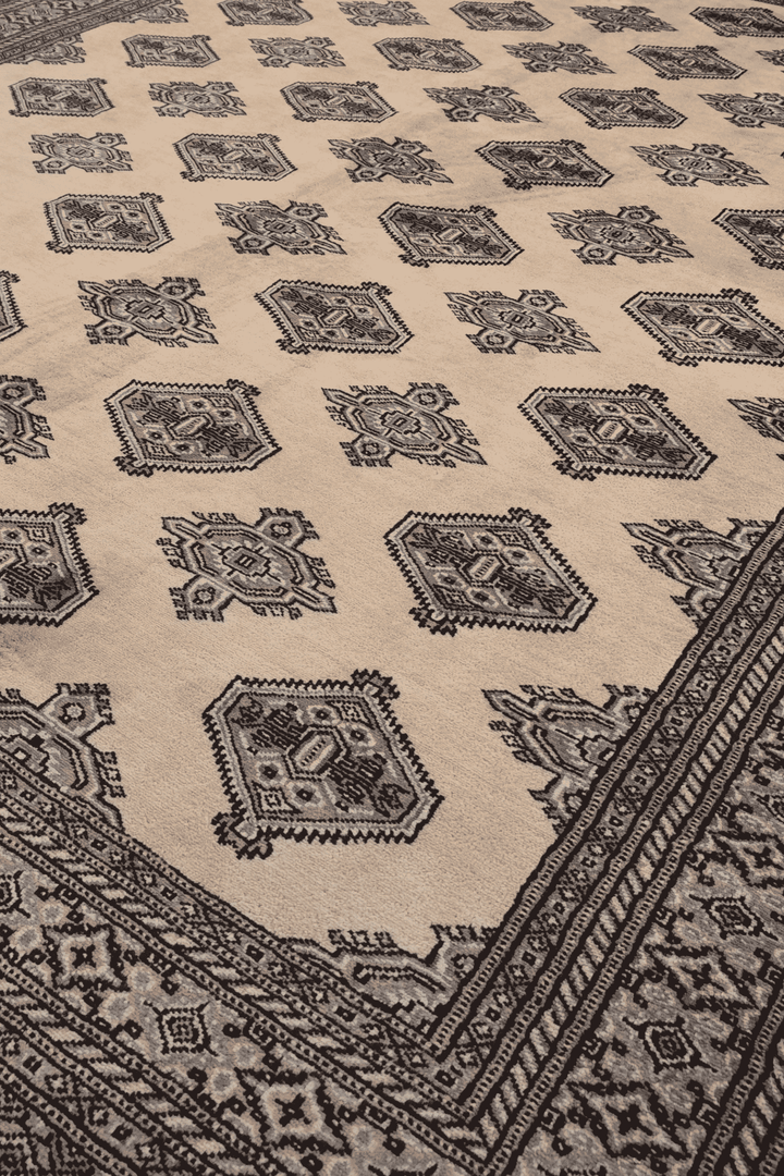 Turkmen gül motifs in cream and espresso on Bokhara rug