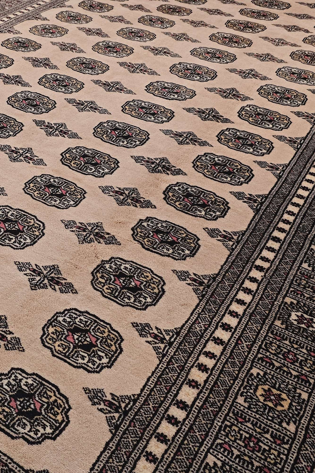 Border detail of cream hand-knotted Bokhara rug, 201×320cm