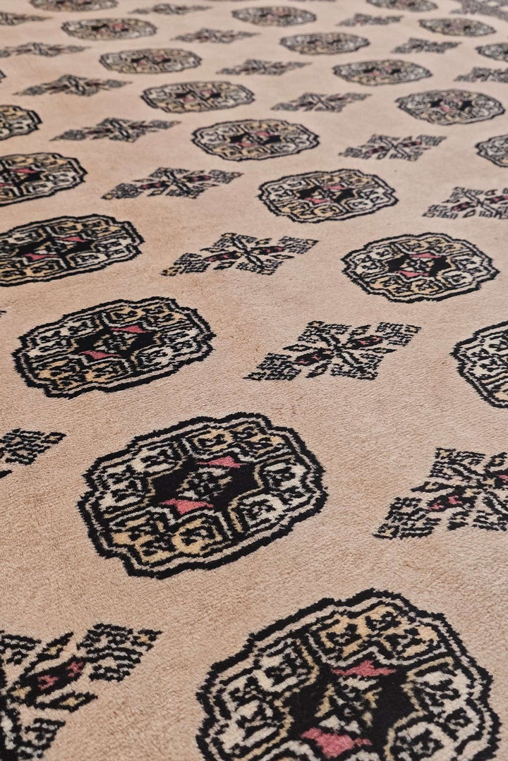 Hand-knotted wool pile of cream Bokhara rug, 201×320cm