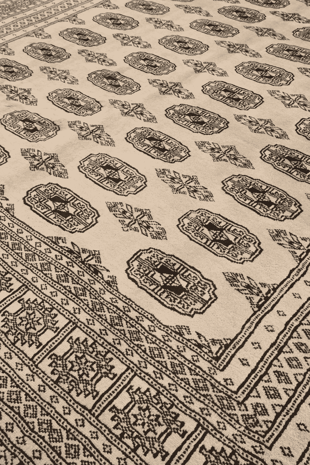 Turkmen gül motifs in cream and walnut on Pakistani Bokhara rug
