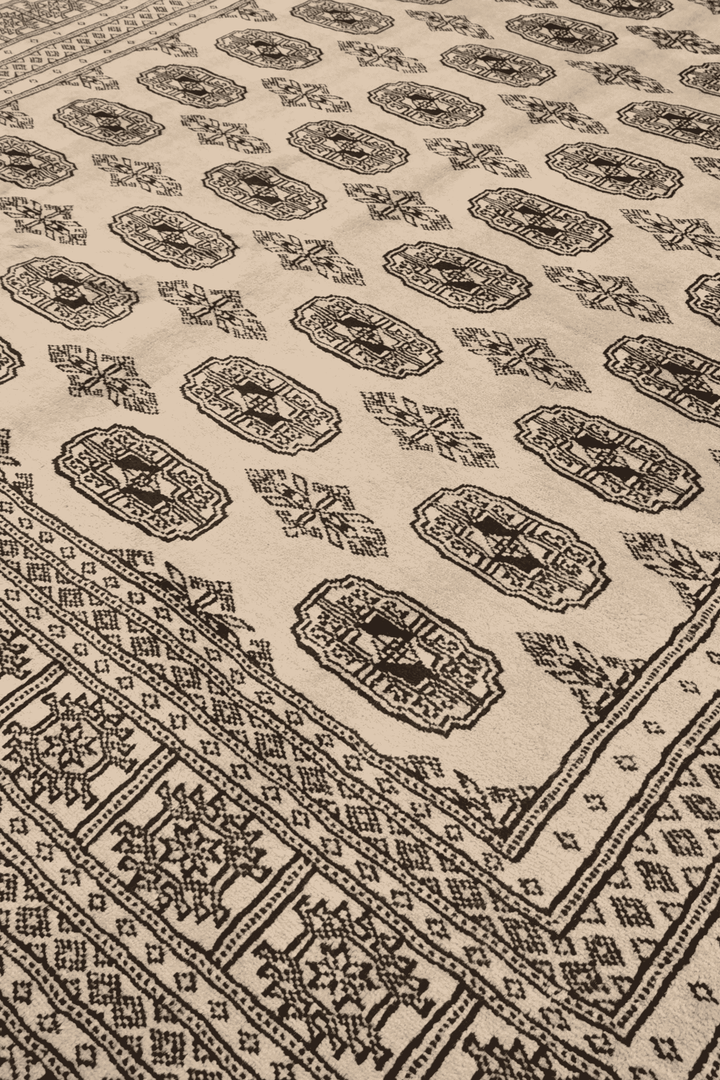 Turkmen gül motifs in cream and walnut on Pakistani Bokhara rug