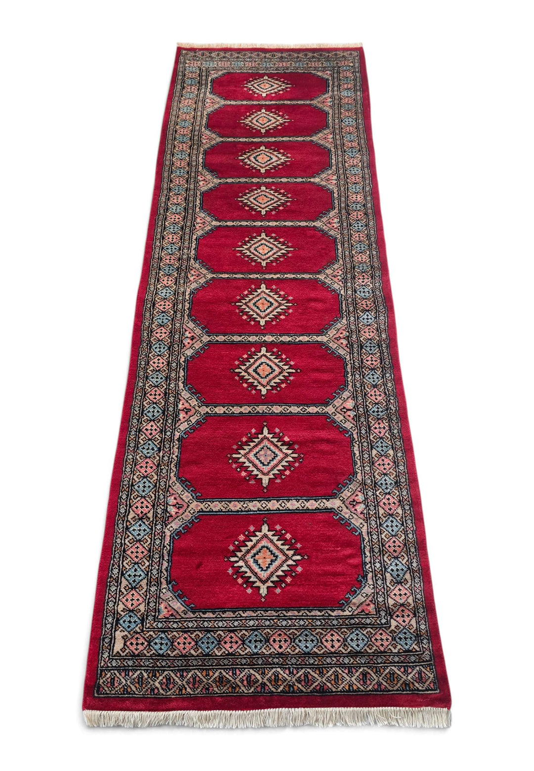 Border detail of crimson and salmon hand-knotted Bokhara runner