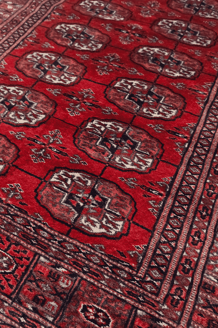 Turkmen gül motifs in deep red and cream on Afghan runner