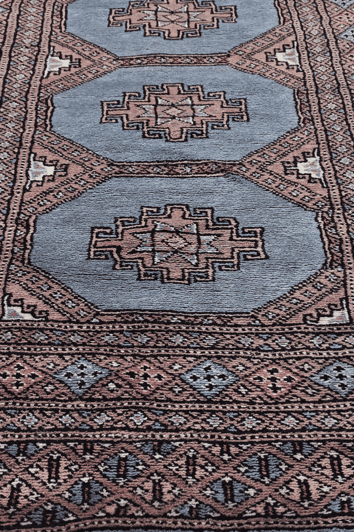 Hand-knotted dusty blue Bokhara runner with stepped medallions