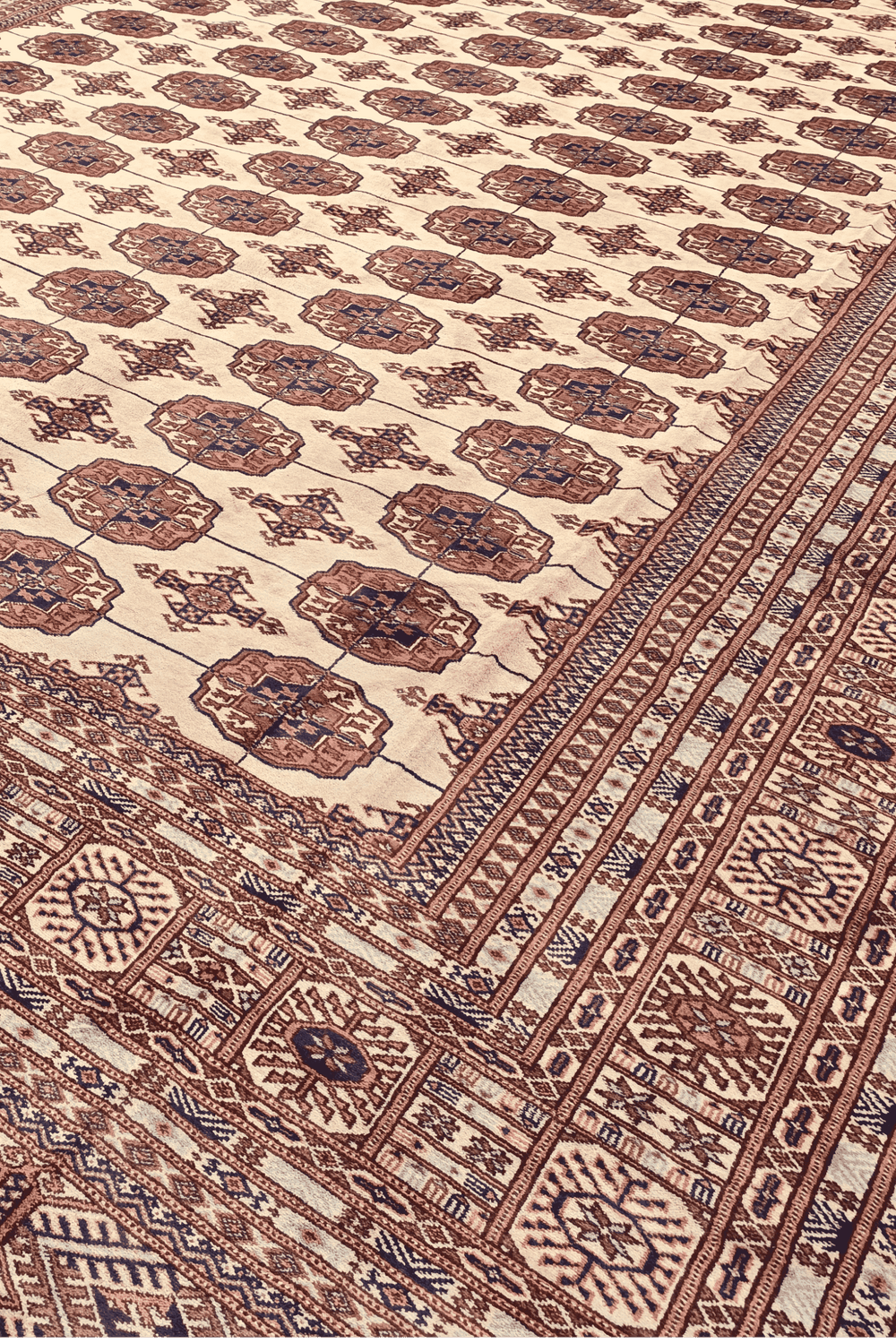 Turkmen gül motifs in ivory and chestnut on Afghan Sherwan rug