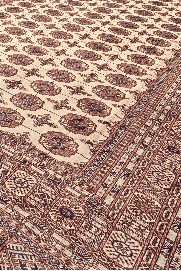 Turkmen gül motifs in ivory and chestnut on Afghan Sherwan rug