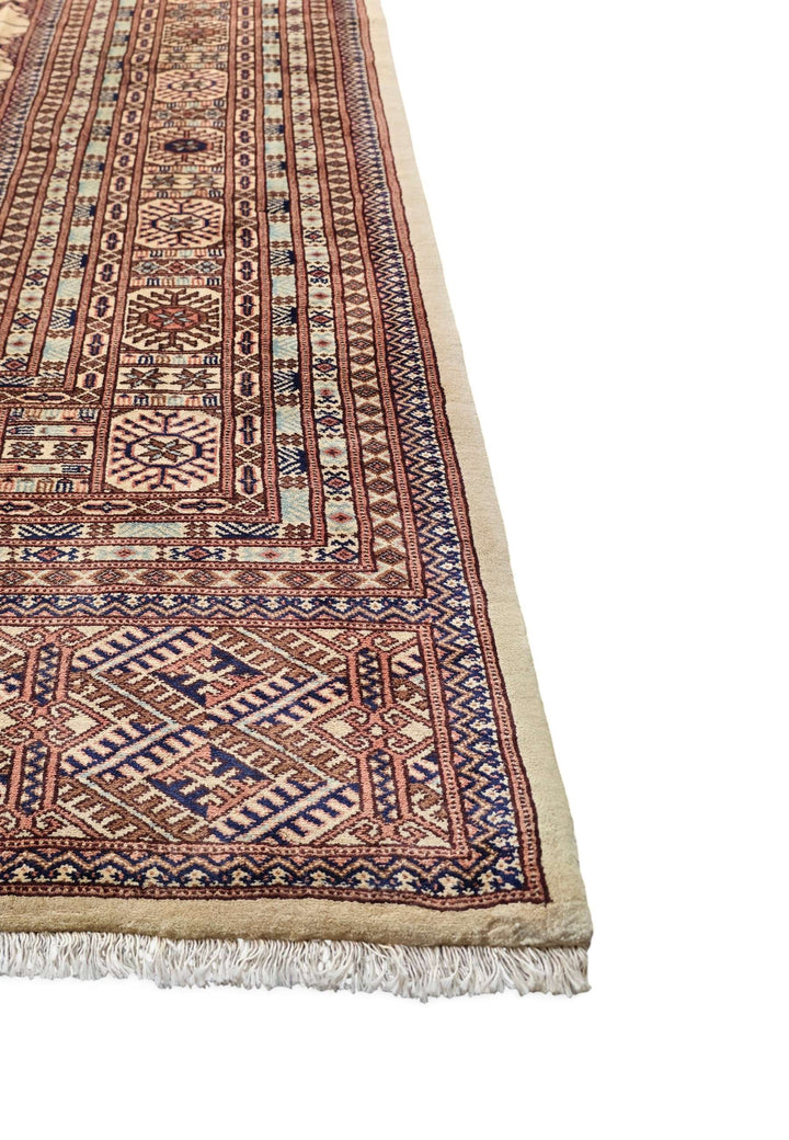 Corner of ivory and chestnut Afghan Sherwan hand-knotted rug