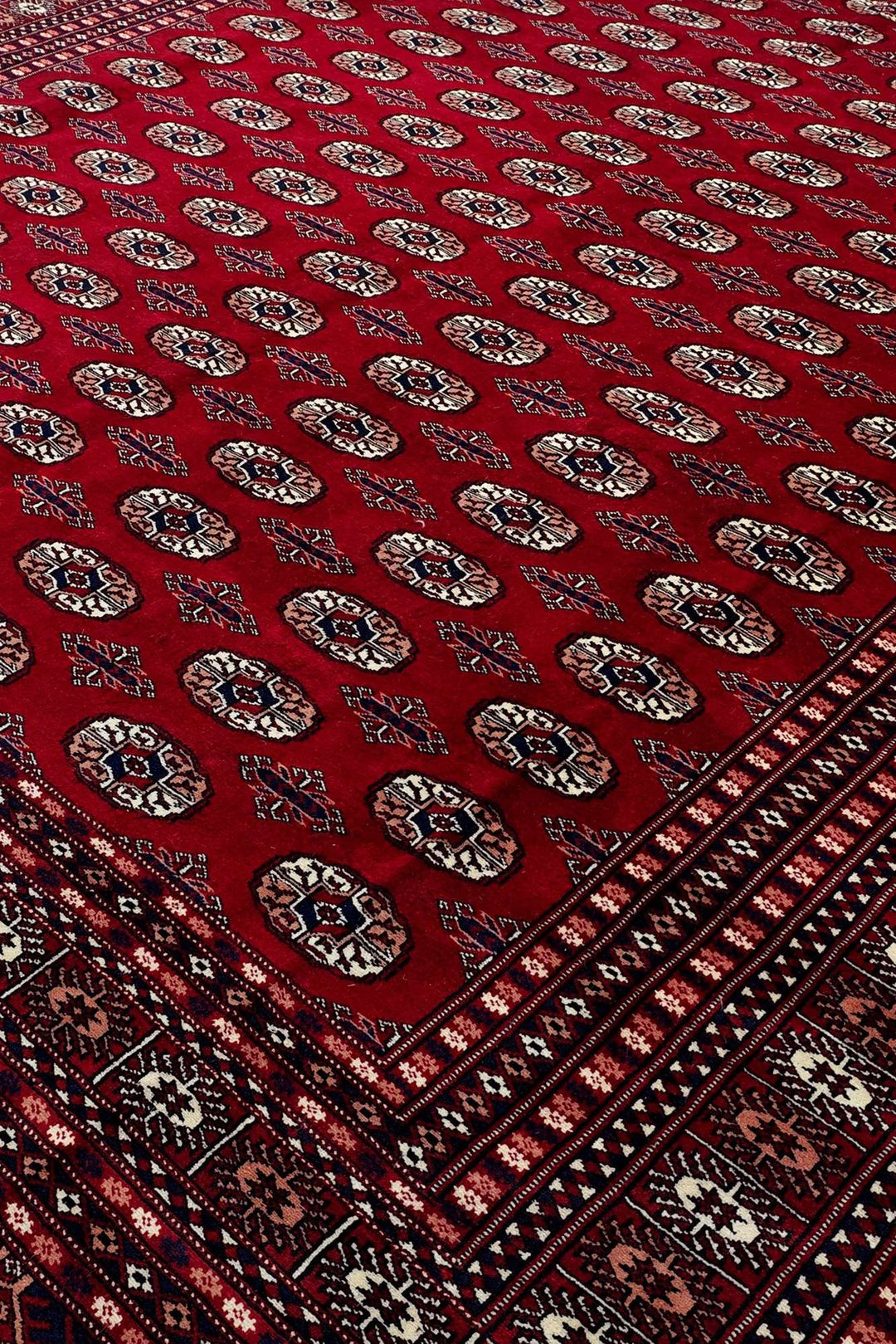 Hand-knotted wool pile of madder red Bokhara rug, 248×303cm