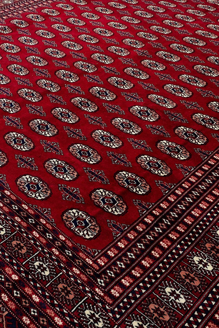 Hand-knotted wool pile of madder red Bokhara rug, 248×303cm