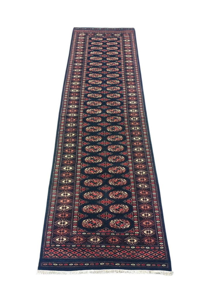 Border detail of navy and rose hand-knotted Bokhara runner