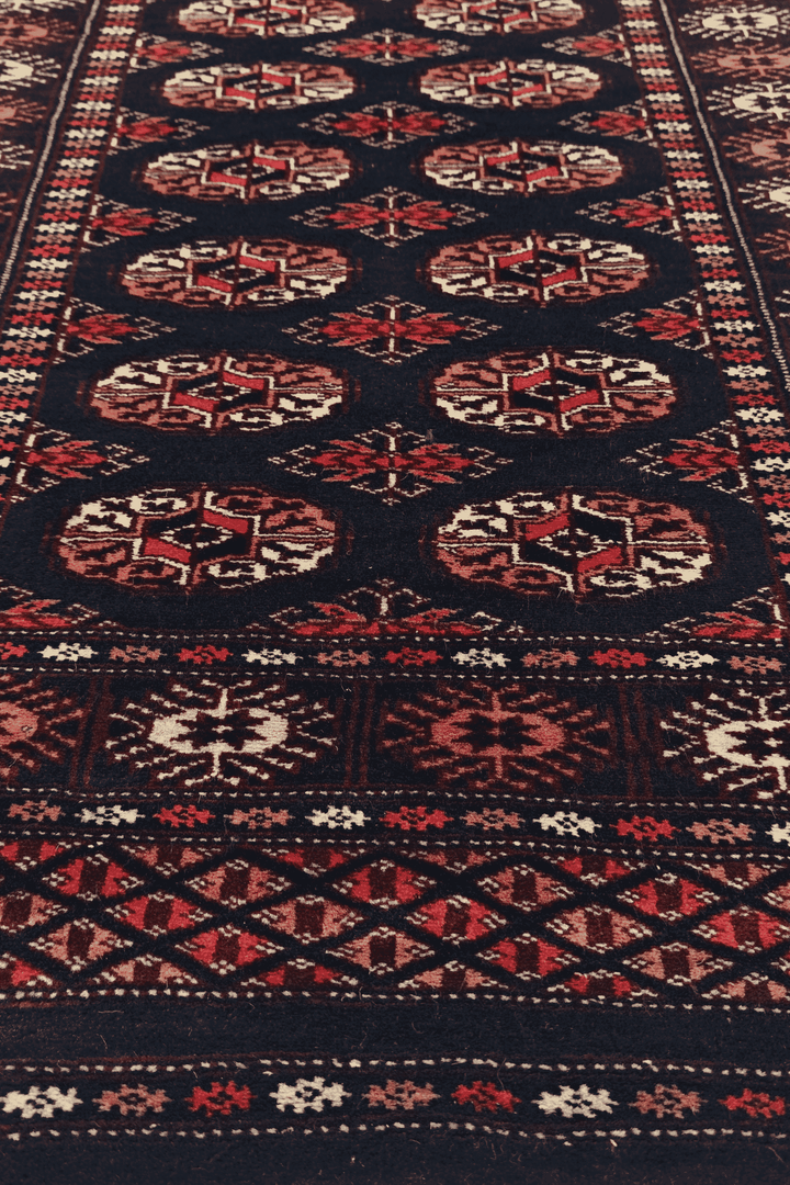 Hand-knotted navy Bokhara runner with rose Turkmen güls