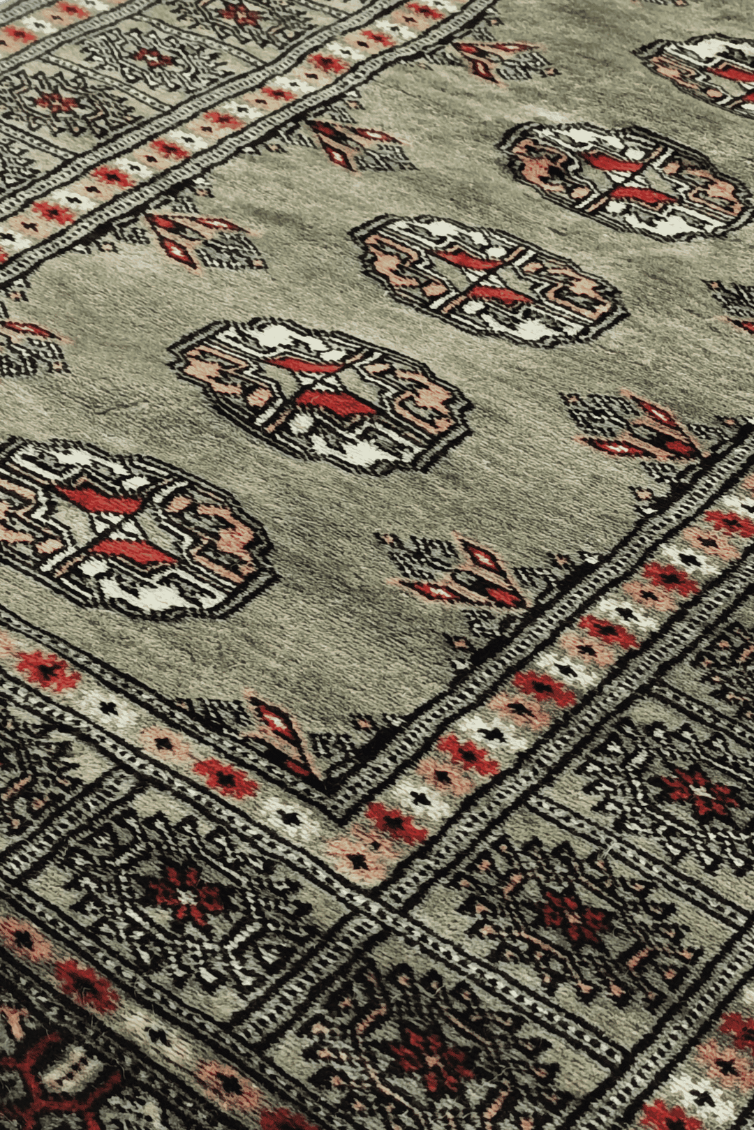 Turkmen gül motifs in olive and peach on Bokhara runner